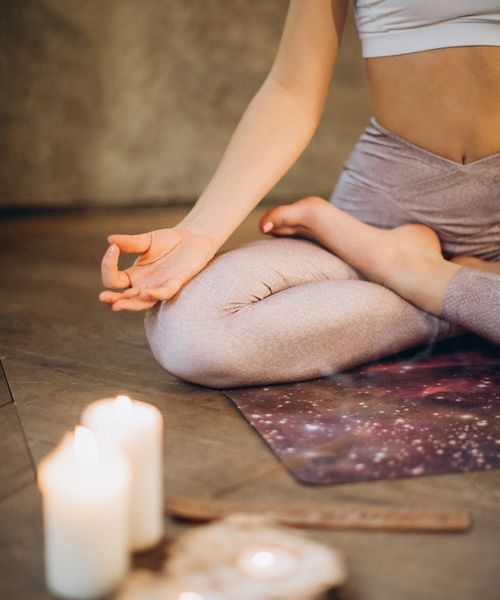 Woman in a calm yoga pose, embodying harmony and balance.